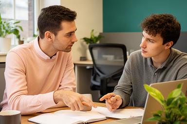 Experienced founder reviewing a startup plan with notes in a Rotherham coworking space